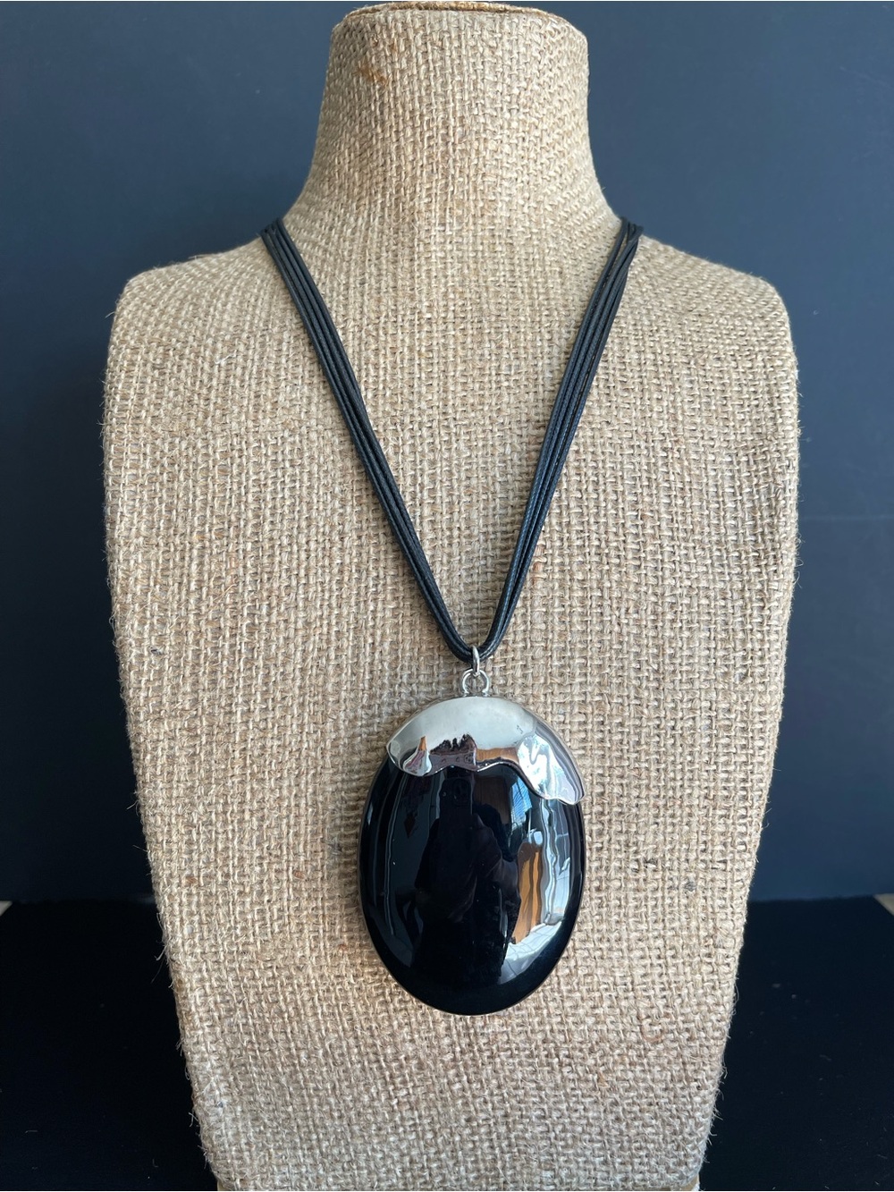 Black Oval Pendant Necklace with black cord.